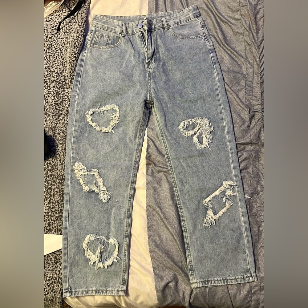 Ripped designed jeans 30x32